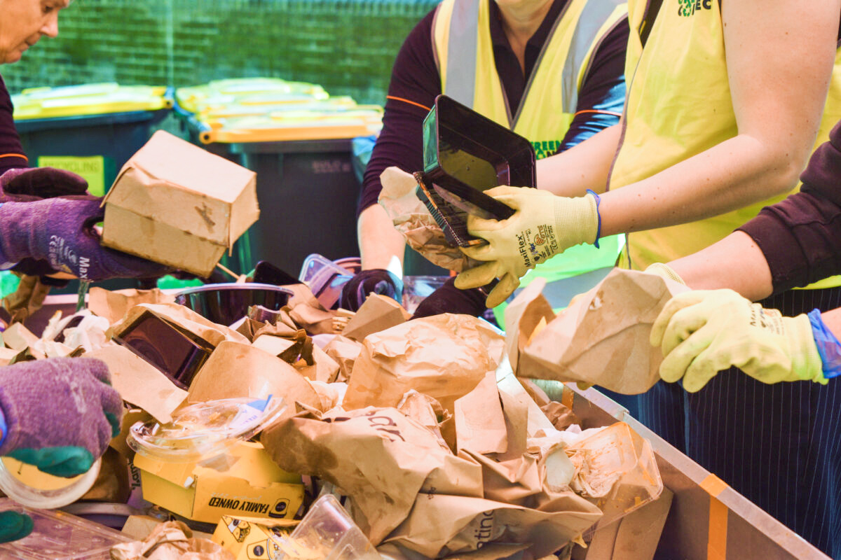 wasteaudit Hands sorting paper waste during a waste audit