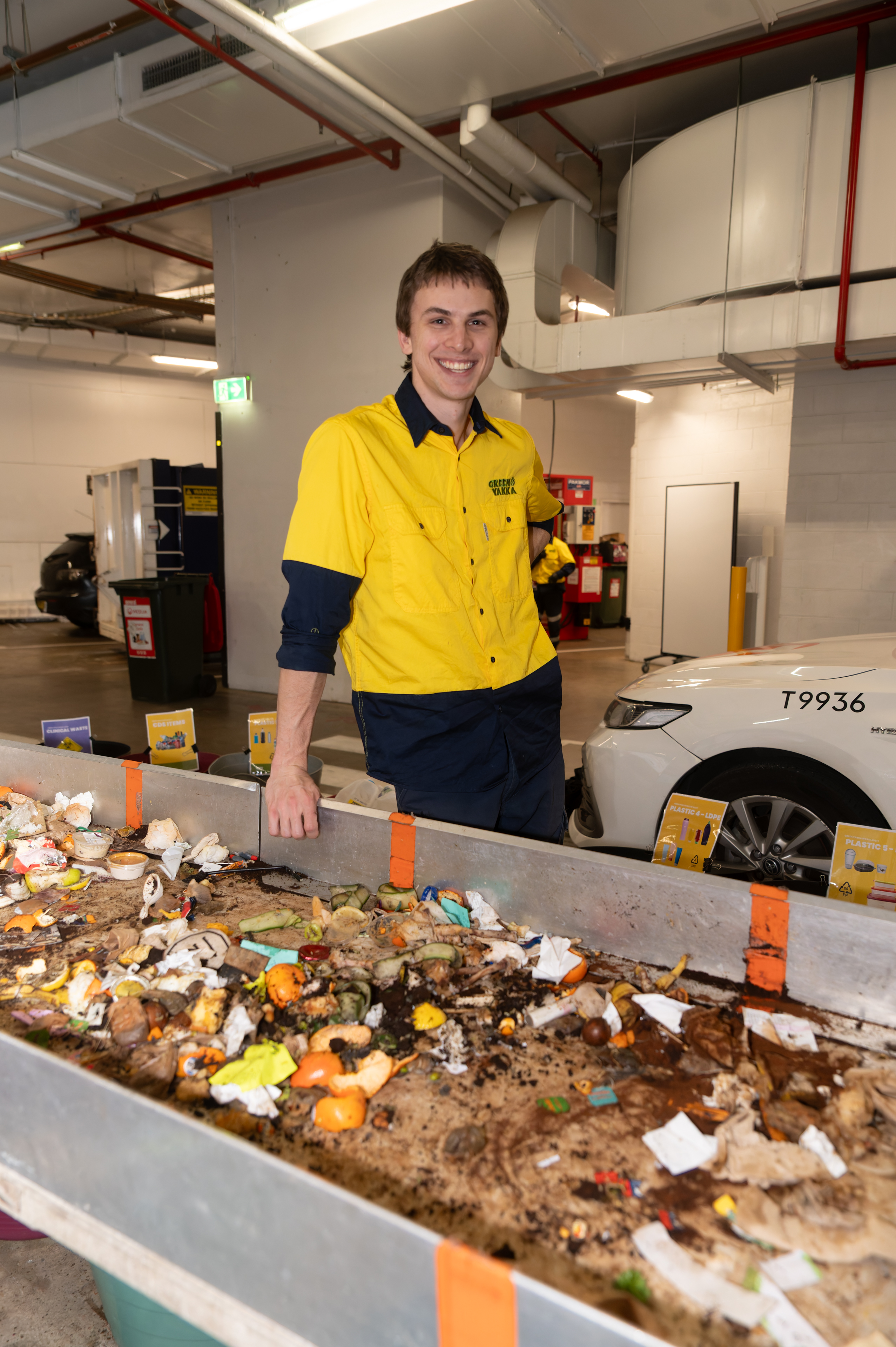 GREEN-YAKKA-WASTE-AUDIT-0182 Young worker looking towards the viewer and smiling